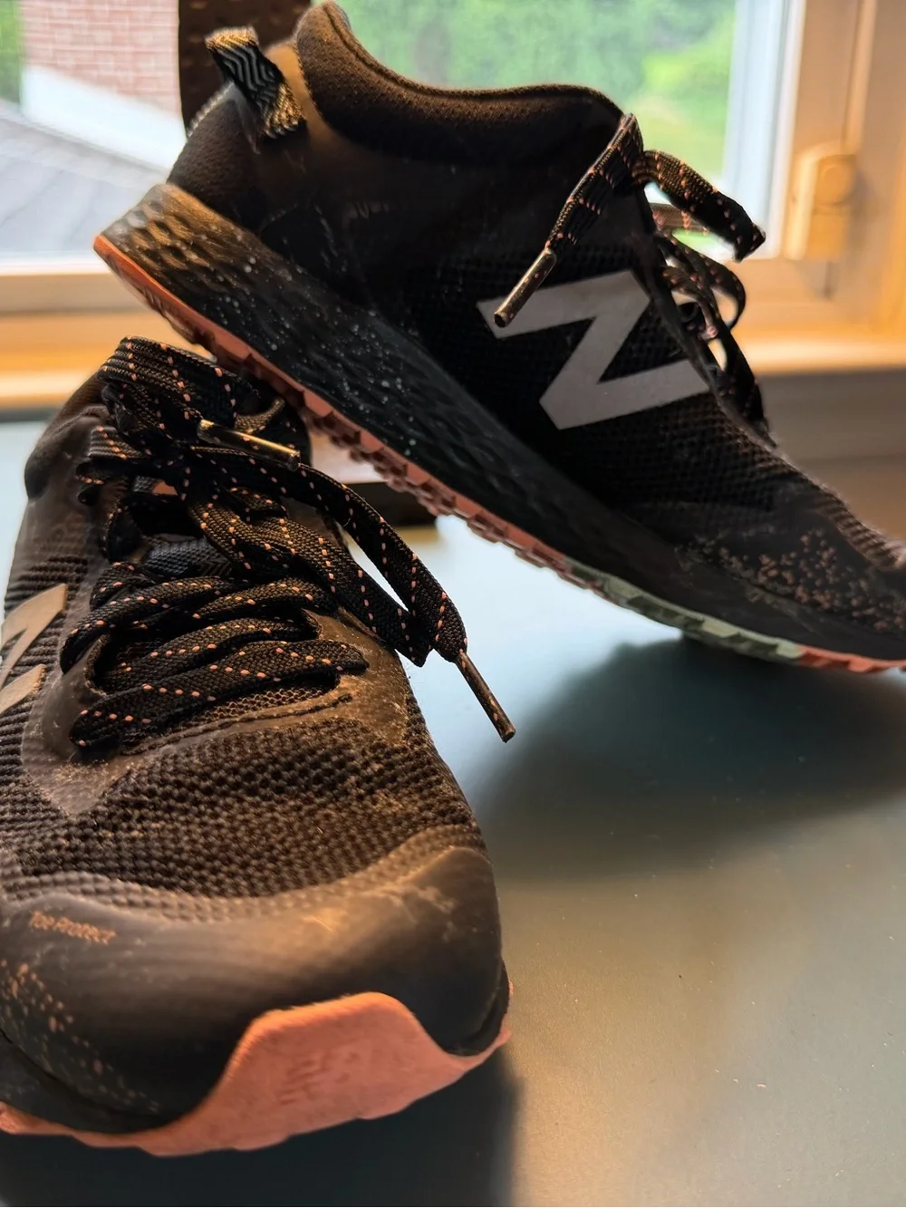 New Balance Kids Black Sneakers with orange/teal Accent